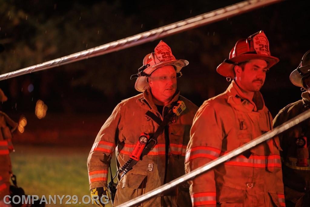 Assistant Chief Riser and Captain Andrew Capone looking over the scene of an MVA